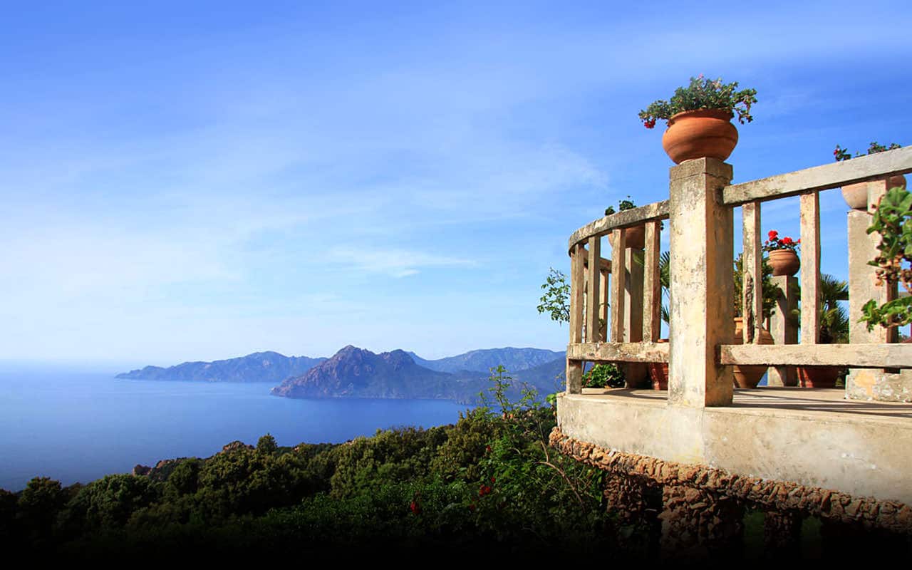 Hotel Les Roches Rouges Piana Corsica balkon met uitzicht